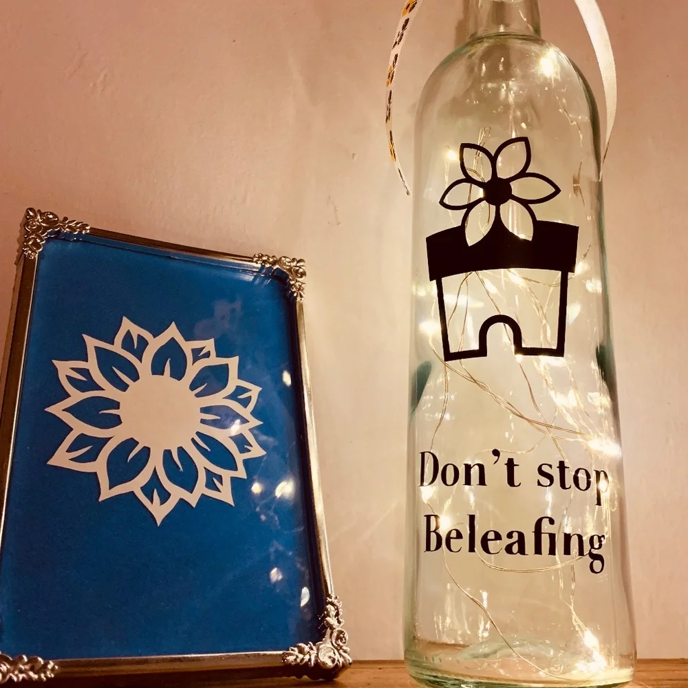 ‘Don’t Stop Beleafing’ logo wine bottle lantern